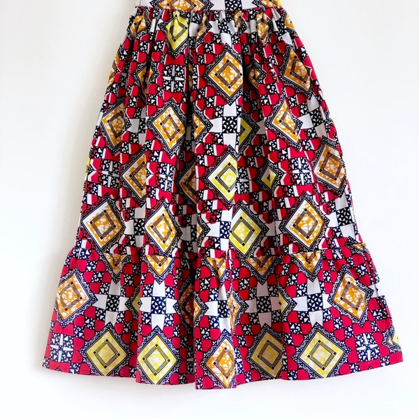 Red and white geometric African print skirt. 100% cotton. Ankle, 7/8 length. Handmade in uk.