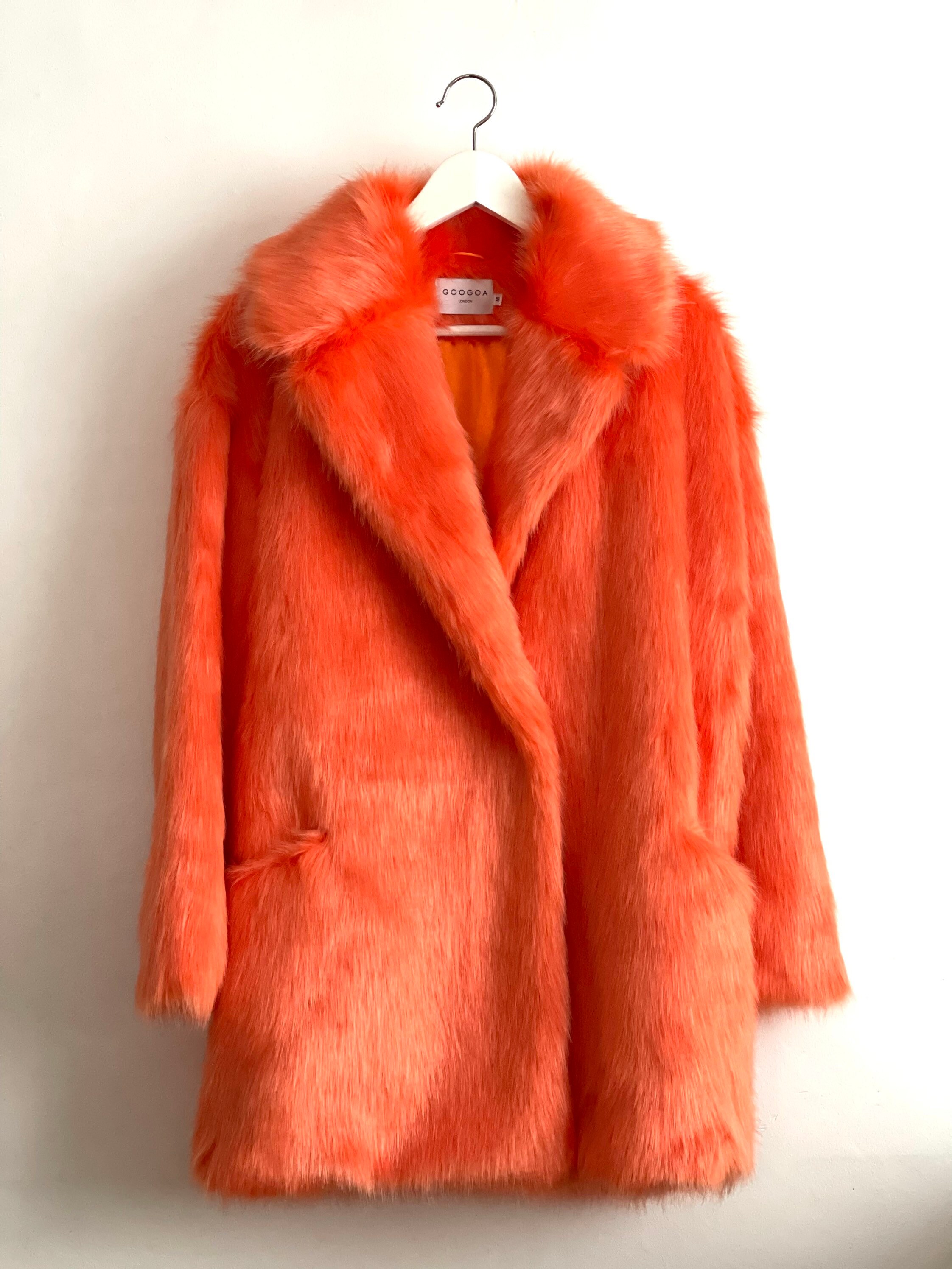 Bright orange top faux fur coat