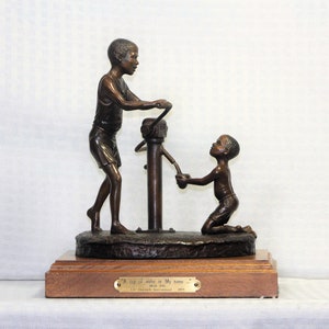 Bronze Sculpture by Dean Shipston, Mission Life, Two Young Boys Pumping Water, Solid Bronze, Wood Base with Brass Nameplate, Life Outreach