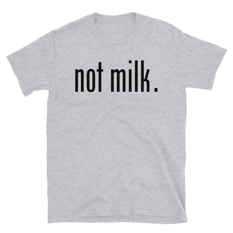 May include: A heather gray short-sleeved t-shirt with the text "not milk." printed in black.