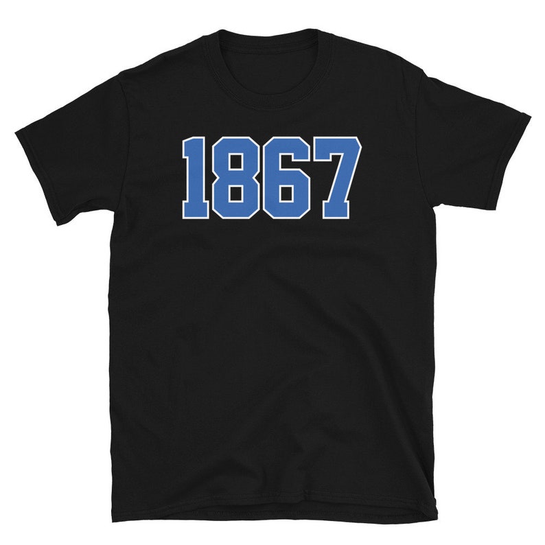 May include: Black t-shirt with the number 1867 printed in blue on the front.