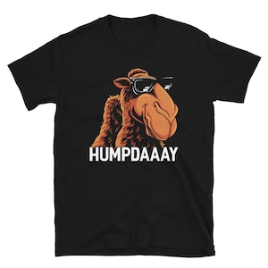 May include: Black t-shirt with a cartoon camel wearing sunglasses and the text "HUMPDAAAY" printed in white.