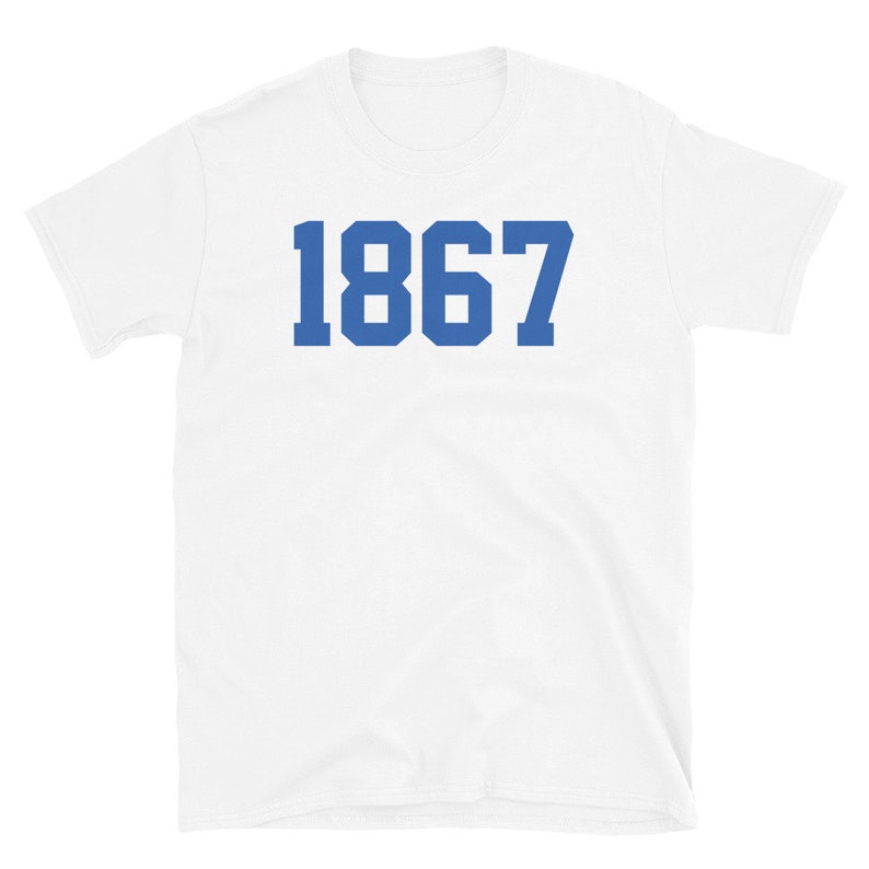 May include: White t-shirt with the number 1867 printed in blue.