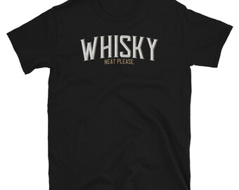 May include: Black t-shirt with the word "WHISKY" in a white, serif font with a shadow effect. Below the word "WHISKY" is the phrase "NEAT PLEASE." The shirt is made of a soft material and has short sleeves.