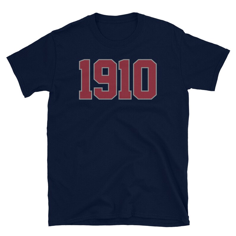 May include: A navy blue t-shirt with the number "1910" printed in red on the front.