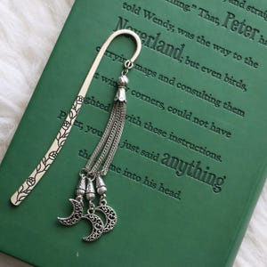 May include: A set of three ceramic mugs with a speckled, matte finish. The mugs are in shades of cream, light gray, and dark gray. Each mug has a simple, minimalist design, perfect for coffee or tea.