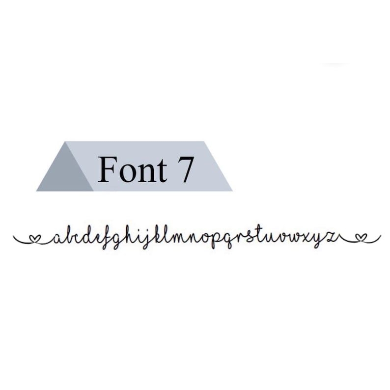May include: Font 7 alphabet in a cursive script with hearts at the beginning and end of the alphabet.