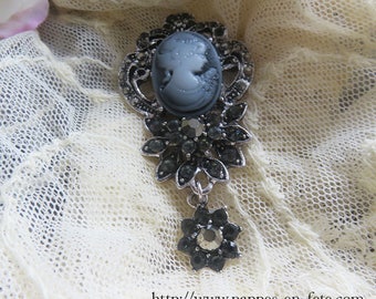 Elegant Gothic brooch with rhinestones and resin cameo