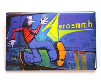 May include: A blue and yellow Aerosmith magnet with a cartoon illustration of a person running with a large shoe.