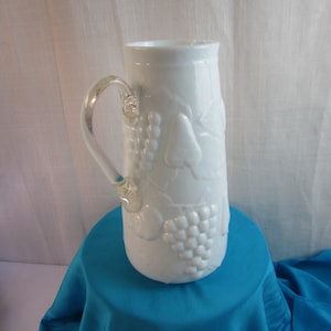 White Milk Glass Pitcher With Clear Glass Handle Embossed Fruit Pattern