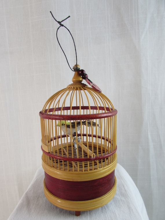 Singing bird in cage wind up discount