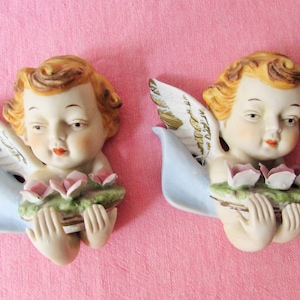 Pair of Bisque/ Cherubs/ Angels wall hangings