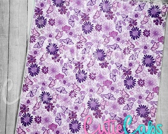 May include: Purple and white floral print fabric with butterflies. The fabric has a subtle shimmer and is ideal for crafting projects.