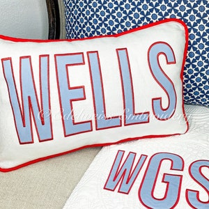 Boudoir Lumbar Name pillow(Classic Block appliqué  font) in white linen base fabric. Matching quilt available at www.edelweissembroidery.com