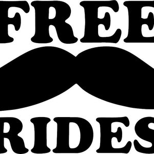 Puede incluir: Diseño gráfico en blanco y negro con el texto "FREE RIDES" y un gran bigote negro.