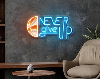 May include: Neon sign with a basketball and the words "NEVER give UP" in blue neon. The sign is mounted on a gray wall with a brown armchair and a wooden coffee table in front of it.