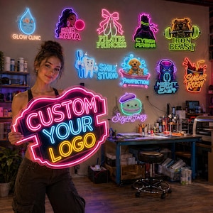 May include: A custom neon sign featuring the text CUSTOM YOUR LOGO in bright pink and yellow light, shaped like a decorative plaque. The sign is held in front of a wall displaying various other colorful neon signs with diverse graphic designs.
