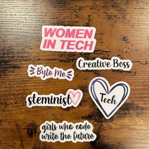 May include: Five stickers with empowering messages for women in tech. The stickers feature phrases like "Women in Tech", "Byte Me", "Creative Boss", "Steminist", and "Girls who code write the future".