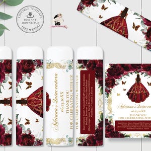 May include: Lip balm tubes and a card featuring a quinceañera theme. The design includes a burgundy dress, butterflies, and floral accents. The text reads "Adriana's Quinceañera" and "Thank you for celebrating with us!"