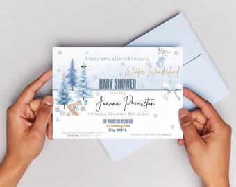May include: A baby shower invitation with a winter wonderland theme. The invitation features blue watercolor trees, snowflakes, and a teddy bear. The text reads "Baby Shower" and invites guests to celebrate Joanna Princeton.