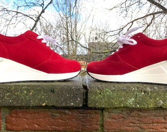 Naturläufer red suede sneakers with heel.