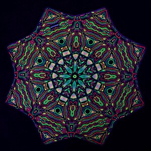 May include: A multi-pointed star-shaped tapestry featuring a vibrant, symmetrical mandala pattern in neon green, pink, and blue against a solid black background. The intricate design includes repeating geometric shapes, wavy lines, and circular motifs.
