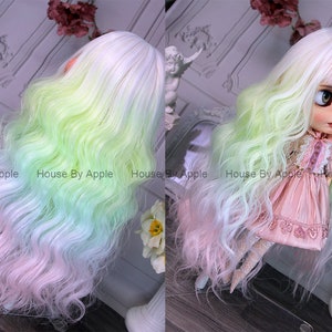 May include: A long, wavy doll wig with a gradient of white, light green, and pink. The wig is styled with a side part and bangs.