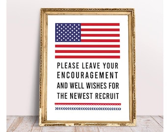 May include: Framed print featuring the American flag at the top. Below the flag, the text reads: "PLEASE LEAVE YOUR ENCOURAGEMENT AND WELL WISHES FOR THE NEWEST RECRUIT." Decorative borders in red and blue.
