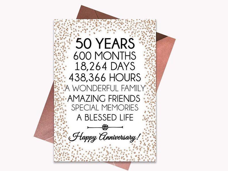 May include: A white card with gold glitter confetti and black text that reads "50 Years, 600 Months, 18,264 Days, 438,366 Hours, A Wonderful Family, Amazing Friends, Special Memories, A Blessed Life, Happy Anniversary!"