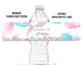 May include: Editable water bottle label with a mermaid tail, pink and blue watercolor background, and the text "Amelia's 5th Birthday".