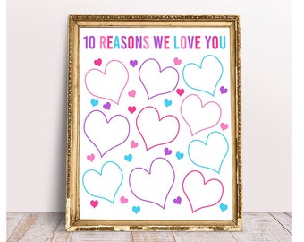 May include: A framed print with the text "10 REASONS WE LOVE YOU" in colorful letters. The print features ten large, outlined hearts and smaller hearts in pink, purple, and blue. The frame is gold-colored.