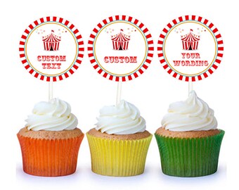 May include: Three cupcakes with red, white and blue circus tent themed cupcake toppers. The toppers have the text "Custom Text", "Custom", and "Your Wording".