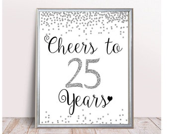 May include: A white printable sign with silver glitter confetti and the text "Cheers to 25 Years" in black.