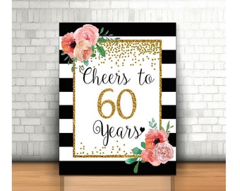 May include: Black and white striped background with gold glitter and floral accents. The text "Cheers to 60 Years" is written in gold glitter.