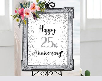 May include: A silver framed sign with a white background and silver glitter confetti. The sign says "Happy 25th Anniversary" in black script font.