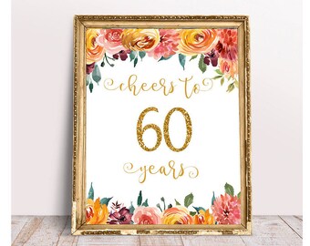 May include: A printable sign with a floral border and gold glitter text that reads "Cheers to 60 years".