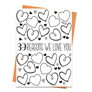May include: A white card with a black and white illustration of hearts and the text "39 reasons we love you".