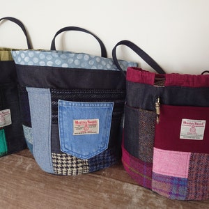 May include: Three patchwork tote bags made with denim, tweed and plaid fabric. Each bag features a label that reads "Harris Tweed".
