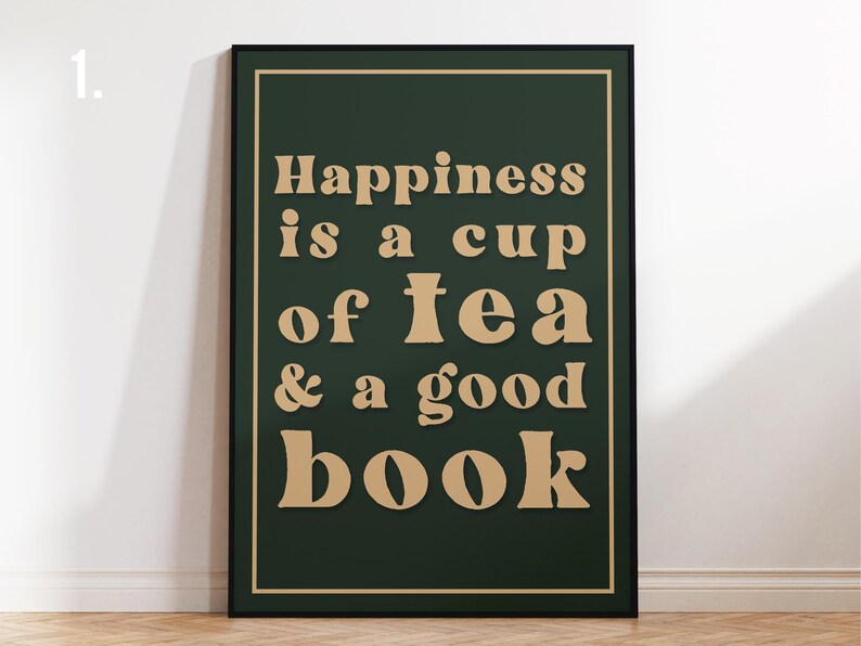 May include: A dark green framed poster with the text "Happiness is a cup of tea & a good book" in a light brown font.