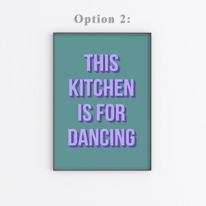 May include: A teal framed print with the text "THIS KITCHEN IS FOR DANCING" in purple.
