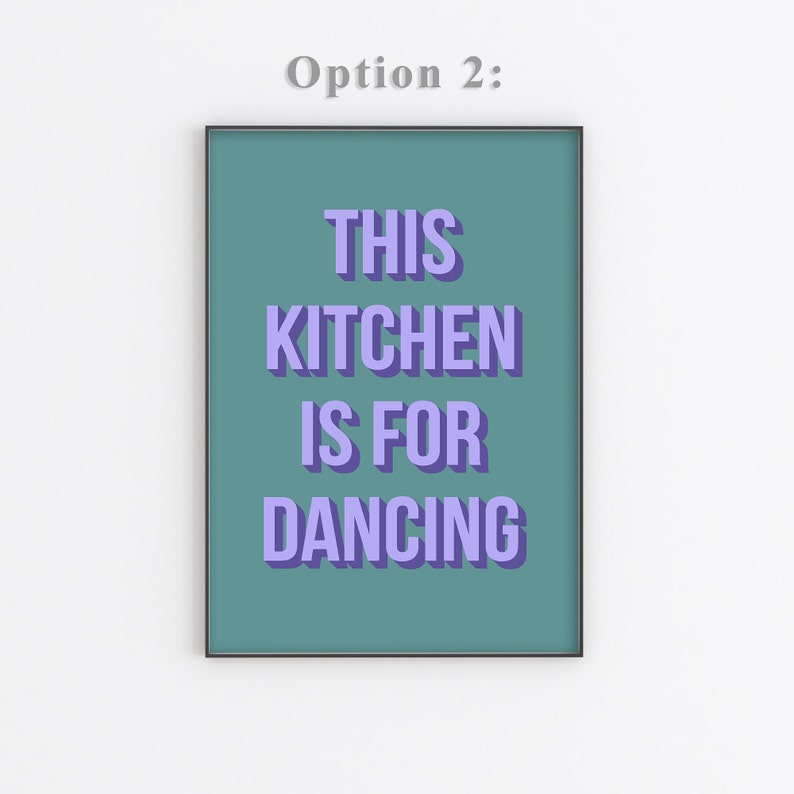 May include: A teal framed print with the text "THIS KITCHEN IS FOR DANCING" in purple.