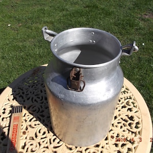 Old aluminum milk can, antique milk jug, farmhouse decoration