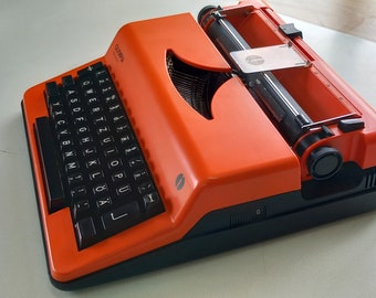 Olympia Monica Electric Typewriter - Orange Typewriter with Black Keyboard and Black plastic case, 1970 Model