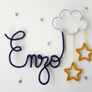 Knitted first name with cloud decoration and 2 stars