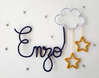 Knitted name decorated with a cloud and 2 stars