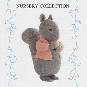 May include: A knitted grey squirrel toy from the Beatrix Potter Nursery Collection. The squirrel wears a pink jacket and holds a yellow object. The image includes the text "Beatrix Potter Nursery Collection" and "Timmy Tiptoes".