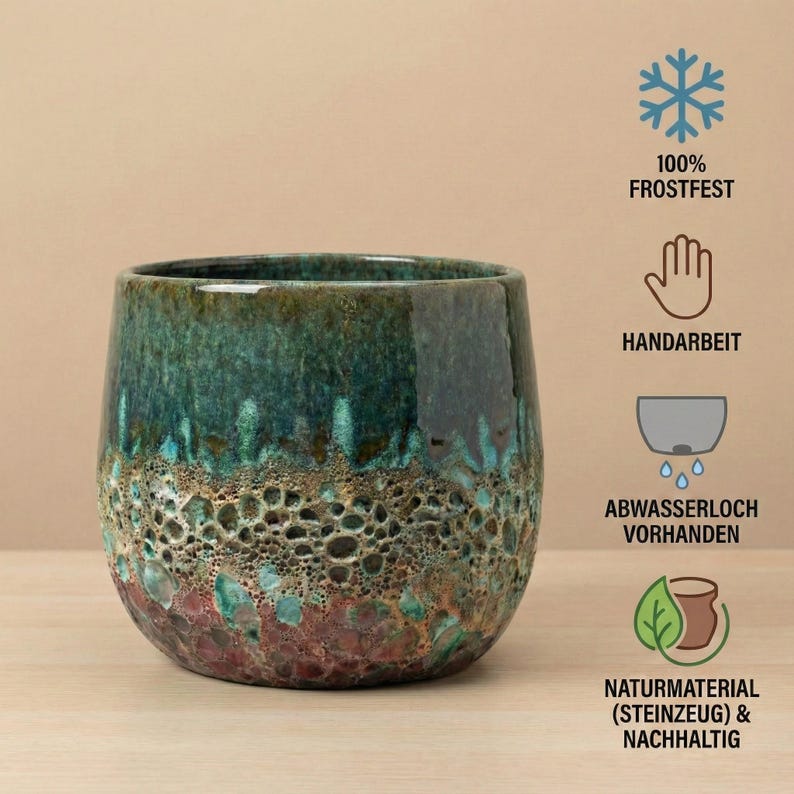 May include: A ceramic planter with a glossy finish. The planter has a dark teal top that fades into a textured, porous, brown and red base. The planter is handmade and frost-resistant.