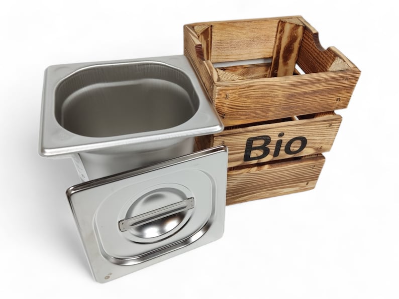 May include: A stainless steel food container with a lid and a wooden crate labelled "Bio".
