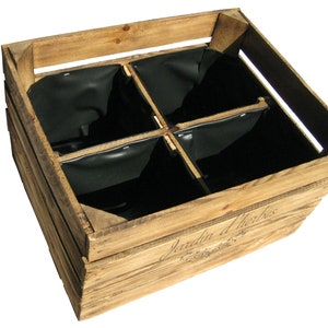 May include: A wooden crate with four black fabric inserts. The crate is labeled "Jardin d'Herbes".