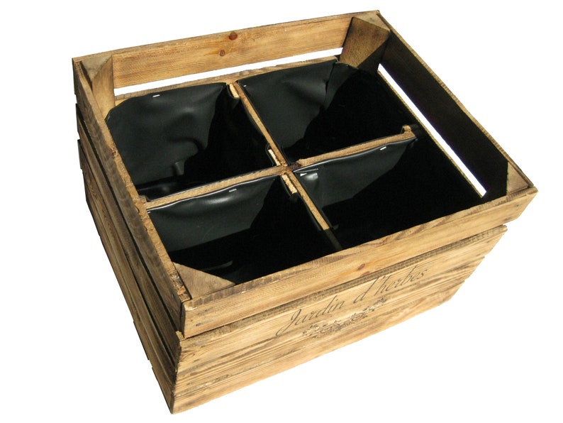 May include: A wooden crate with four black fabric inserts. The crate is labeled "Jardin d'Herbes".